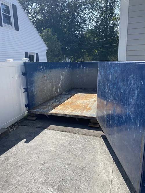 Dumpster Rentals - Driveway Protection with Wood Blocks
